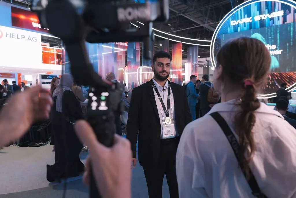 Participant interview with a camera crew at the venue